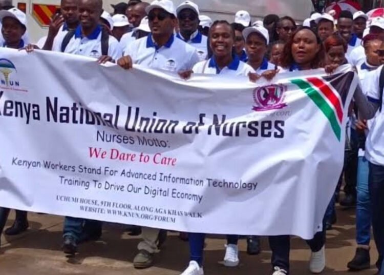 Nurses matching flagging their kenya national union of nurses flier during labour day celebrations. photo knun